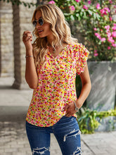 Haut à volants et col en V à motif floral